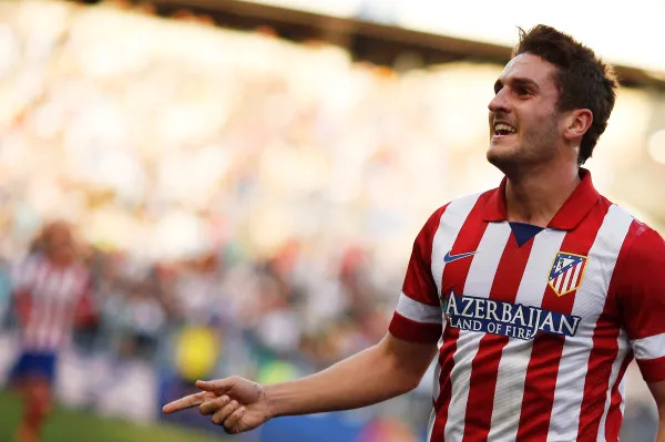 Atletico Madrid's Koke celebrates after scoring a goal against Malaga during their Spanish First Division soccer match in Malaga