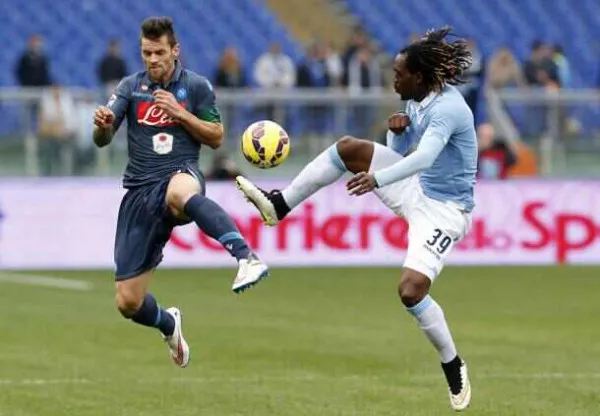 Napoli's Maggio and Lazio's Cavanda jumps for the ball during the Italian Serie A soccer match at the Olympic stadium in Rome