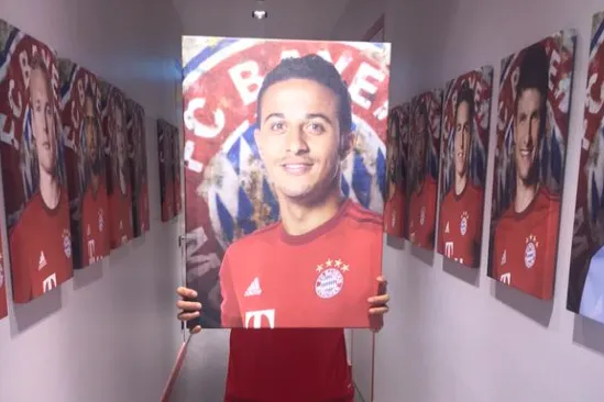 thiago alcantara picture held by javi martinez