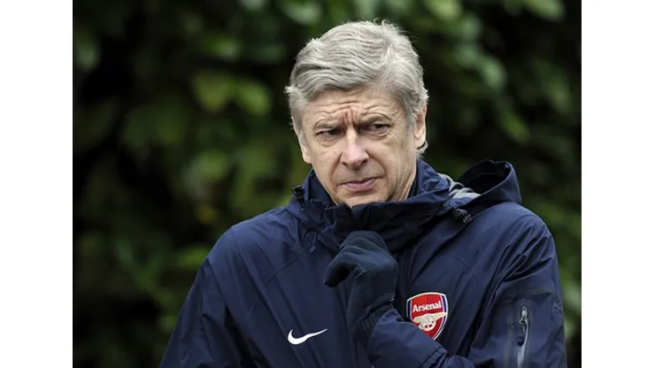 Arsenal's French manager Arsene Wenger gestures before a team training session at the club's Colney training ground in London on February 15, 2011 on the eve of the Champions League round of 16, 1st leg football match against Barcelona. AFP PHOTO/GLYN KIRK (Photo credit should read GLYN KIRK/AFP/Getty Images)