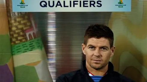 England's Steven Gerrard sits on the bench before their 2014 World Cup qualifying soccer match against San Marino at the Serravalle Stadium in San Marino March 22, 2013. REUTERS/Eddie Keogh