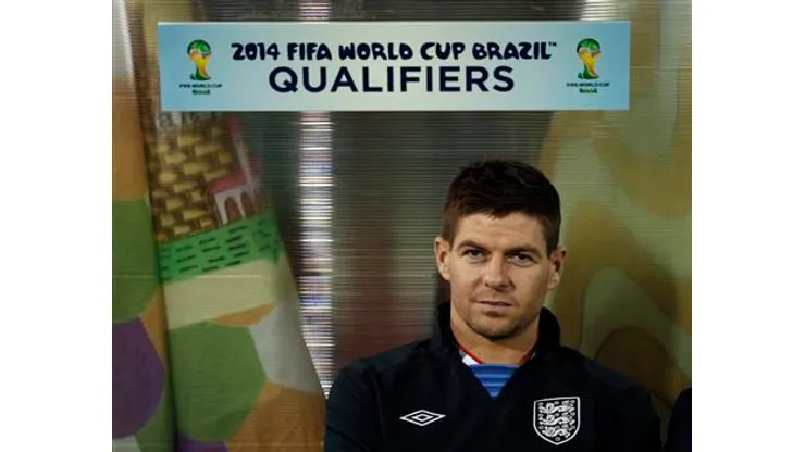 England's Steven Gerrard sits on the bench before their 2014 World Cup qualifying soccer match against San Marino at the Serravalle Stadium in San Marino March 22, 2013. REUTERS/Eddie Keogh