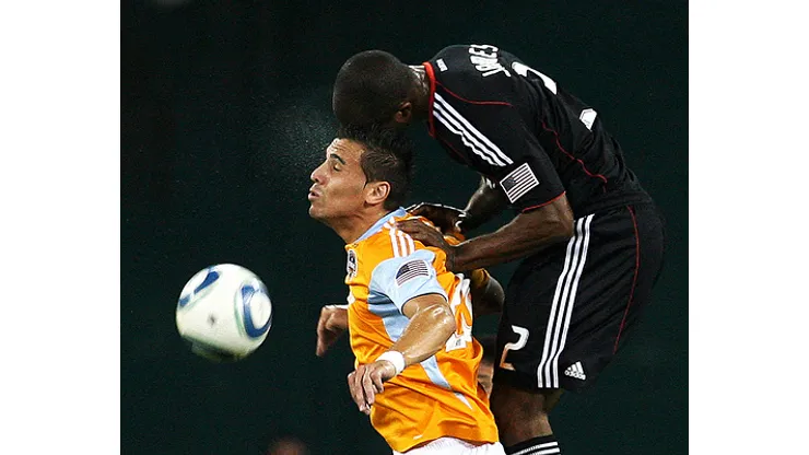 Julius James #2 of D.C. United climbs on the back of Geoff Cameron #20 of the Houston Dynamo during an MLS match at RFK Stadium in Washington D.C. on September 25 2010. Houston won 3-1.