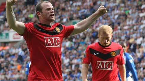 WIGAN, ENGLAND - AUGUST 22: Wayne Rooney of Manchester United celebrates scoring their first goal during the FA Barclays Premier League match between Wigan Athletic and Manchester United at DW Stadium on August 22 2009 in Wigan, England. (Photo by John Peters/Manchester United via Getty Images)