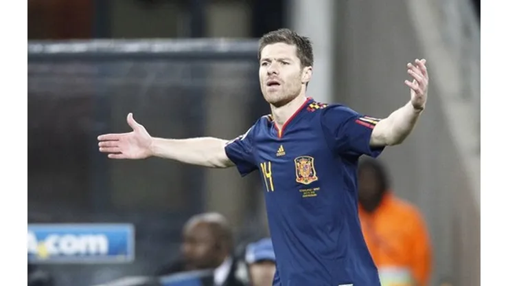 Spain's midfielder Xabi Alonso reacts during the 2010 FIFA football World Cup final between the Netherlands and Spain on July 11, 2010 at Soccer City stadium in Soweto, suburban Johannesburg. NO PUSH TO MOBILE / MOBILE USE SOLELY WITHIN EDITORIAL ARTICLE – AFP PHOTO / THOMAS COEX (Photo credit should read THOMAS COEX/AFP/Getty Images)