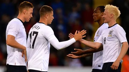 SHEFFIELD, ENGLAND - AUGUST 13: Ross Barkley of England is congratulated on his goal during the Kick it Out International match between England U21 and Scotland U21 at Bramall Lane on August 13, 2013 in Sheffield, England. (Photo by Laurence Griffiths/Getty Images)