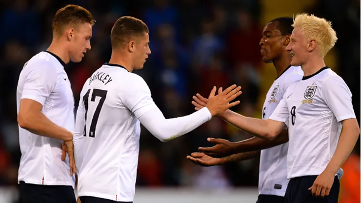 SHEFFIELD, ENGLAND – AUGUST 13: Ross Barkley of England is congratulated on his goal during the Kick it Out International match between England U21 and Scotland U21 at Bramall Lane on August 13, 2013 in Sheffield, England. (Photo by Laurence Griffiths/Getty Images)
