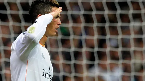 Real Madrid's Portuguese forward Cristiano Ronaldo gestures as he celebrates after scoring a penalty kick during the Spanish league football match Real Madrid CF vs Sevilla FC at the Santiago Bernabeu stadium in Madrid on October 30, 2013. AFP PHOTO / GERARD JULIEN (Photo credit should read GERARD JULIEN/AFP/Getty Images)