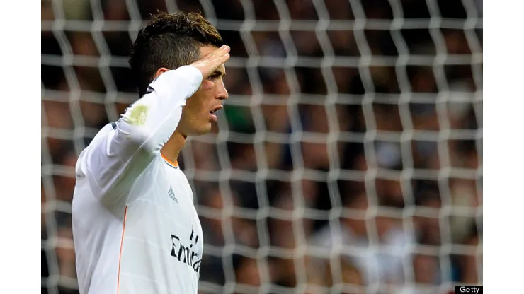 Real Madrid's Portuguese forward Cristiano Ronaldo gestures as he celebrates after scoring a penalty kick during the Spanish league football match Real Madrid CF vs Sevilla FC at the Santiago Bernabeu stadium in Madrid on October 30, 2013. AFP PHOTO / GERARD JULIEN (Photo credit should read GERARD JULIEN/AFP/Getty Images)