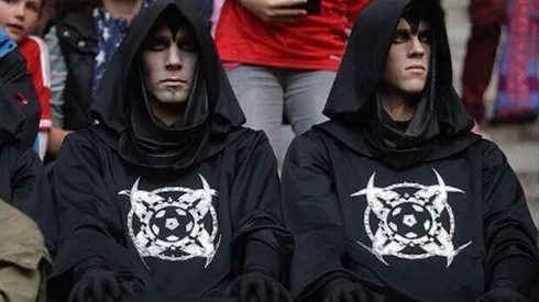 What’s the deal with the black hooded monks in robes at soccer games?
