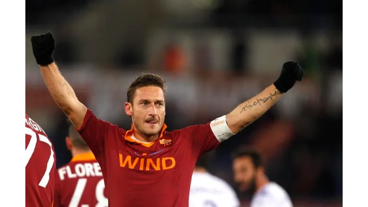 AS Roma forward Francesco Totti celebrates after scoring his second goal during a Serie A soccer match between AS Roma and Fiorentina at Rome's Olympic stadium, Saturday, Dec. 8, 2012. (AP Photo/Alessandra Tarantino)