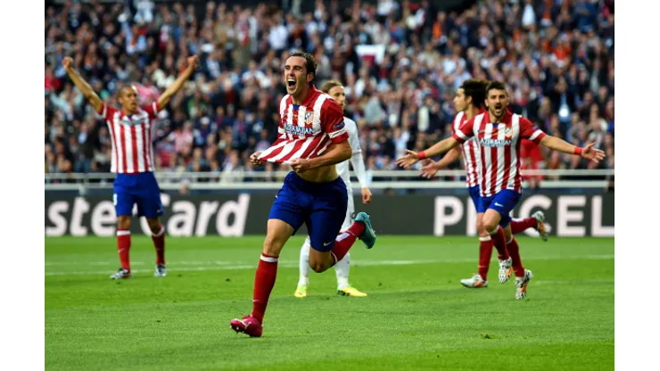 LISBON, PORTUGAL – MAY 24: Diego Godin of Club Atletico de Madrid celebrates scoring the opening goal during the UEFA Champions League Final between Real Madrid and Atletico de Madrid at Estadio da Luz on May 24, 2014 in Lisbon, Portugal. (Photo by Shaun Botterill/Getty Images)
