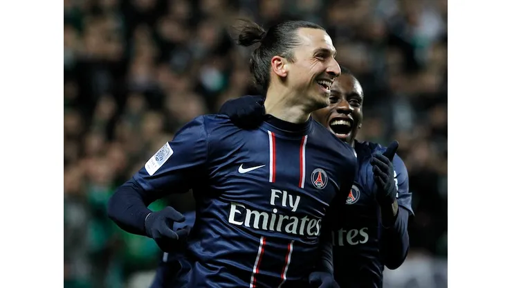 Paris Saint Germain's Zlatan Ibrahimovic celebrates after he scored a goal against Saint-Etienne during their French League One soccer match in Saint-Etienne, central France, Sunday, March 17, 2013. (AP Photo/Laurent Cipriani)