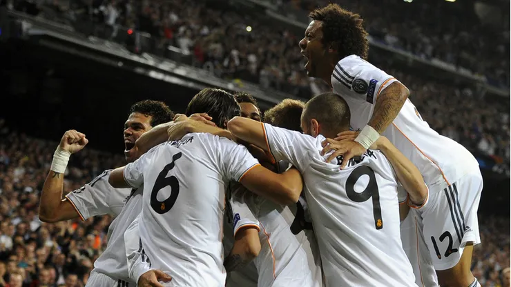Real Madrid's players celebrate their first score the UEFA Champions League Group B football match Real Madrid CF vs Juventus at the Santiago Bernabeu stadium in Madrid on October 23, 2013. AFP PHOTO / JAVIER SORIANO (Photo credit should read JAVIER SORIANO/AFP/Getty Images)