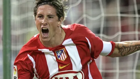 Atletico de Madrid's Fernando Torres, left celebrates with his team mate Mateja Kezman of Serbia - Montenegro after Torres scored against Barcelona during a Spanish league soccer match at the Vicente Calderon stadium in Madrid Sunday Sept. 18, 2005. (AP Photo/Paul White)