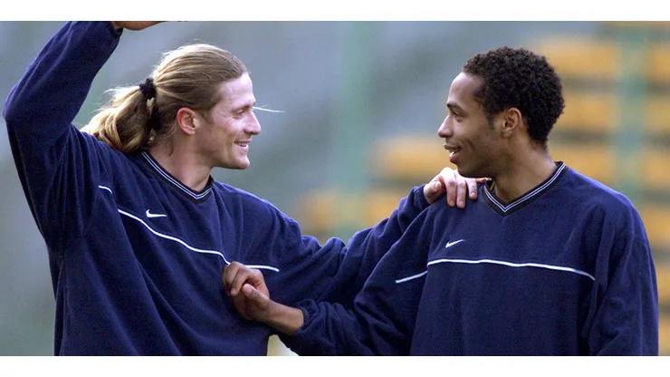 Thierry Henry (R) and French team mate Emmanuel Petit at Arsenal train in Lens April 19 before their UEFA Cup semifinal match tomorrow. – RTXJMSU