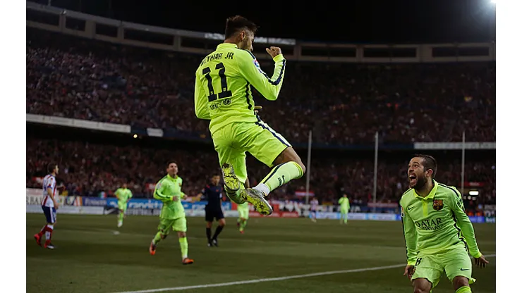 Barcelona's Neymar, centre, celebrates his goal with team mates during a second leg quarterfinal Copa del Rey soccer match between Atletico de Madrid and FC Barcelona at the Vicente Calderon stadium in Madrid, Spain, Wednesday, Jan. 28, 2015. (AP Photo/Andres Kudacki)