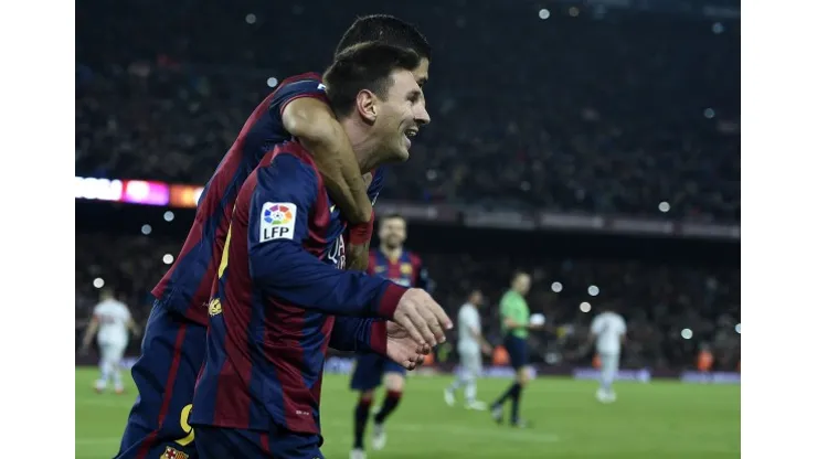 Barcelona's Argentinian forward Lionel Messi celebrates after scoring a goal during the Spanish Copa del Rey (King's Cup) quarter final first leg football match FC Barcelona vs Atletico de Madrid at the Camp Nou stadium in Barcelona on January 8, 2015. AFP PHOTO/ LLUIS GENE (Photo credit should read LLUIS GENE/AFP/Getty Images)