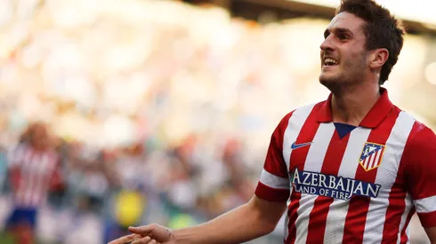 REFILE - WITH ADDITIONAL INFORMATION Atletico Madrid's Jorge "Koke" Resurrecion celebrates his goal against Real Madrid during their Spanish first division soccer match at Vicente Calderon stadium in Madrid March 2, 2014. REUTERS/Andrea Comas (SPAIN - Tags: SPORT SOCCER)