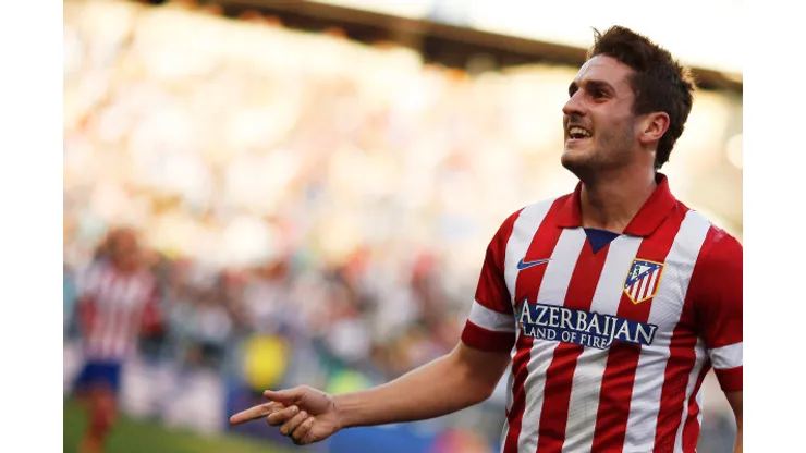 REFILE – WITH ADDITIONAL INFORMATION Atletico Madrid's Jorge "Koke" Resurrecion celebrates his goal against Real Madrid during their Spanish first division soccer match at Vicente Calderon stadium in Madrid March 2, 2014. REUTERS/Andrea Comas (SPAIN – Tags: SPORT SOCCER)