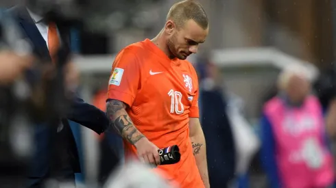 Netherlands' midfielder Wesley Sneijder walks off the pitch following defeat in a penalty shoot out after extra-time in the semi-final football match between Netherlands and Argentina of the FIFA World Cup at The Corinthians Arena in Sao Paulo on July 9, 2014. AFP PHOTO / PEDRO UGARTE (Photo credit should read PEDRO UGARTE/AFP/Getty Images)