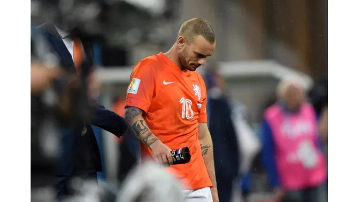 Netherlands' midfielder Wesley Sneijder walks off the pitch following defeat in a penalty shoot out after extra-time in the semi-final football match between Netherlands and Argentina of the FIFA World Cup at The Corinthians Arena in Sao Paulo on July 9, 2014. AFP PHOTO / PEDRO UGARTE (Photo credit should read PEDRO UGARTE/AFP/Getty Images)