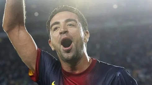 Barcelona midfielder Xavi says he's glad he didn't leave club