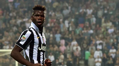 Juventus French midfielder Paul Labile Pogba celebrates after scoring a goal during the Serie A football match between Sassuolo and Juventus at the Mapei Stadium in Reggio Emilia on October 18, 2014 . AFP PHOTO / GIUSEPPE CACACE (Photo credit should read GIUSEPPE CACACE/AFP/Getty Images)