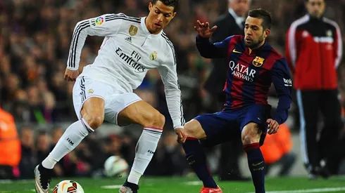 BARCELONA, SPAIN - MARCH 22: Cristiano Ronaldo of Real Madrid CF takes on Jordi Alba of Barcelona during the La Liga match between FC Barcelona and Real Madrid CF at Camp Nou on March 22, 2015 in Barcelona, Spain. (Photo by David Ramos/Getty Images)