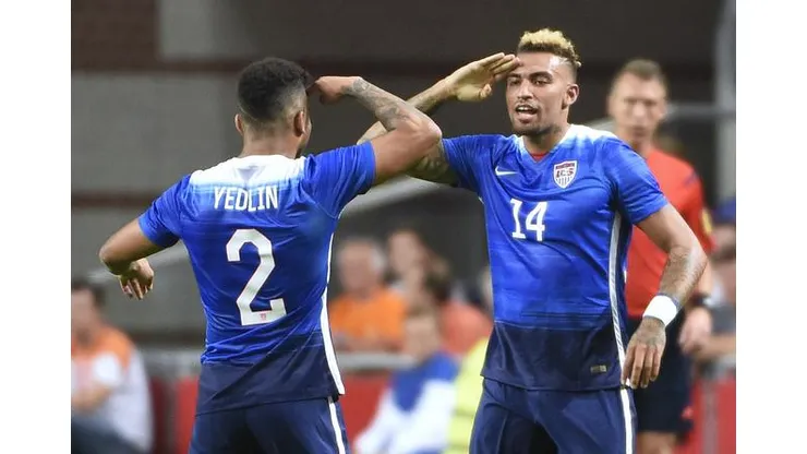 US Danny Williams (R) celebrates with US DeAndre Yedlin (L) after scoring a goal during the friendly football match between the Netherlands and USA on June 5, 2015 at the Arena Stadium in Amsterdam. AFP PHOTO / JOHN THYSJOHN THYS/AFP/Getty Images