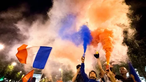 Police use tear gas on Champs Elysees after France win