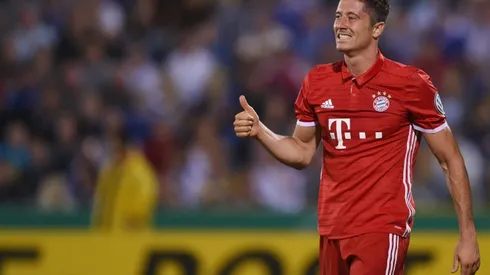 Lewandowski treble sees Bayern through in German Cup