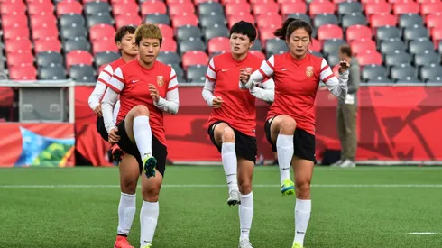 China women's football team complains less than French, coach says