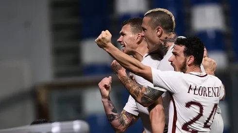 Dzeko at the double as Roma stick to Juve