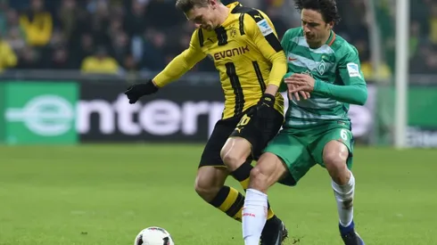 Piszczek rescues Dortmund at 10-man Bremen