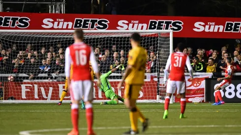 Ton-up Walcott ends Sutton's FA Cup dream