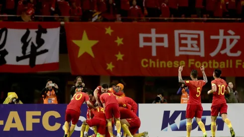 Lippi's China keep World Cup dream alive, Qatar slump