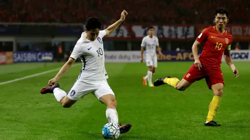 China stun Koreans to keep World Cup hopes alive