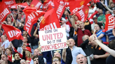 Man Utd fans celebrate triumph after tragedy