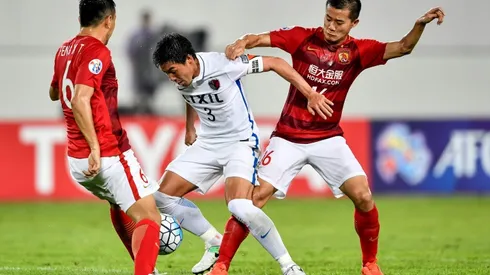 Paulinho puts Evergrande in sight of last eight