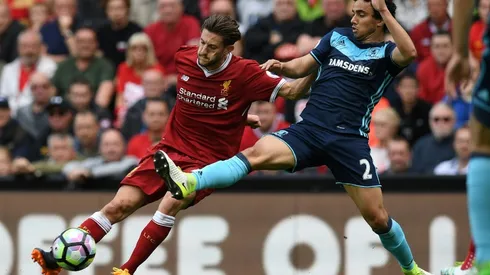 Lallana helps Liverpool secure Champions League spot
