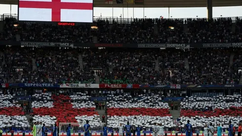 France honours terror victims as Macron, May attend England friendly