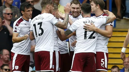 Burnley stun nine-man Chelsea, Huddersfield go top
