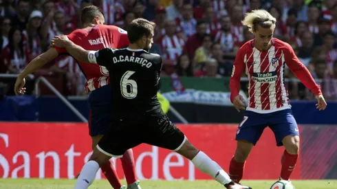 Diego Costa watches Griezmann fire Atletico into second