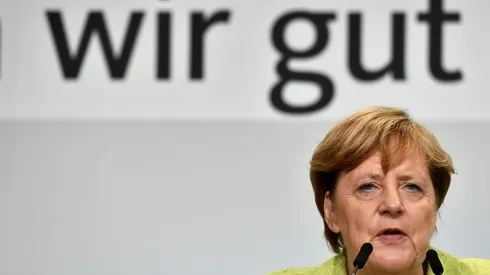Merkel urges tougher rules to end sky-high transfers