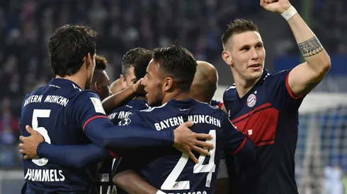 Bayern edge past Hamburg to go level with Dortmund