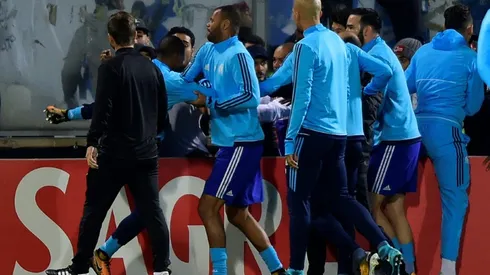 Marseille's Evra charged by UEFA for kicking fan
