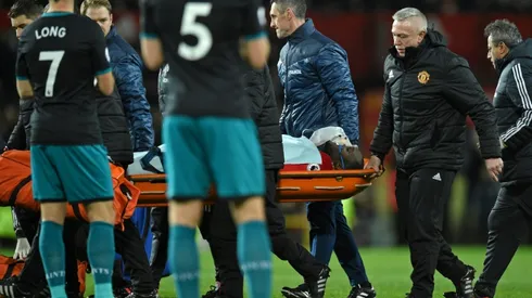 Lukaku carried off after clash of heads