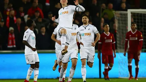 Battling Swansea shock Liverpool