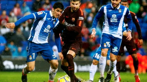 Pique keeps Barca unbeaten, Atletico cut gap